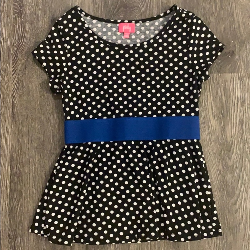 Black, white, and blue polka dotted blouse.